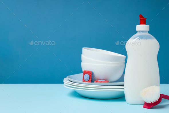 Laundry accessories on white table against blue background Stock Photo by  AtlasComposer