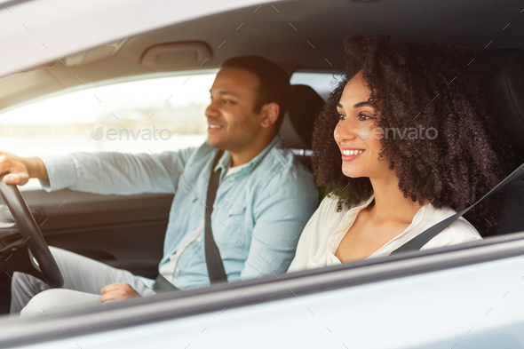 Happy Middle Eastern Car Owners Couple Enjoying Ride In Auto