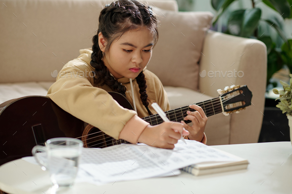 Girl Composing Song - Stock Photo - Images