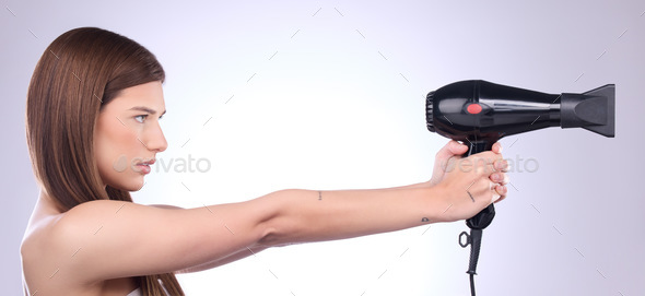 Hair care, dryer and woman with a styling product isolated on a white background in studio. Salon,