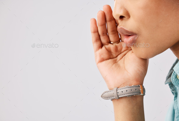 Woman, secret and hand over mouth on mockup in studio against a gray background to whisper gossip o