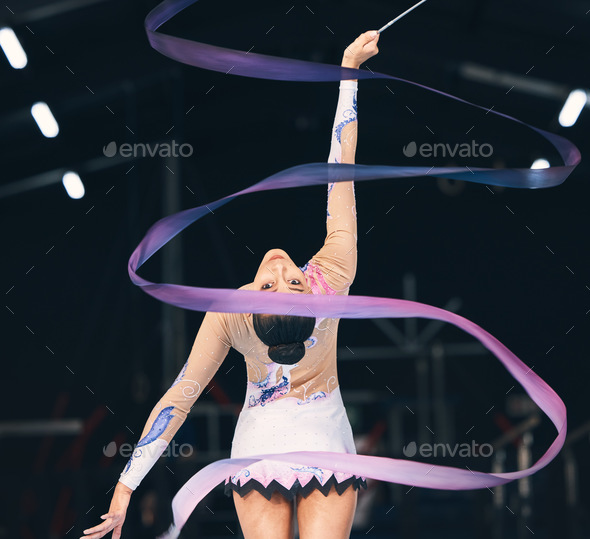 Woman Performing Rhythmic Gymnastics With A Ribbon Isolated On