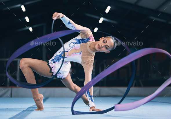 Woman Performing Rhythmic Gymnastics With A Ribbon Isolated On