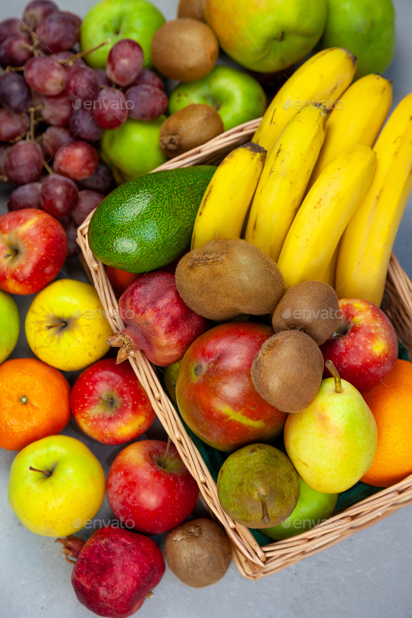 Fruit basket, set of different fruits top view. Vitamin food. Bananas