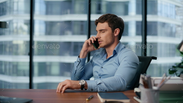 Upset business man talking phone closeup. Angry entrepreneur discussing problems