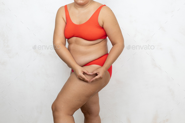 Fat woman in underwear isolated on white background, cellulite