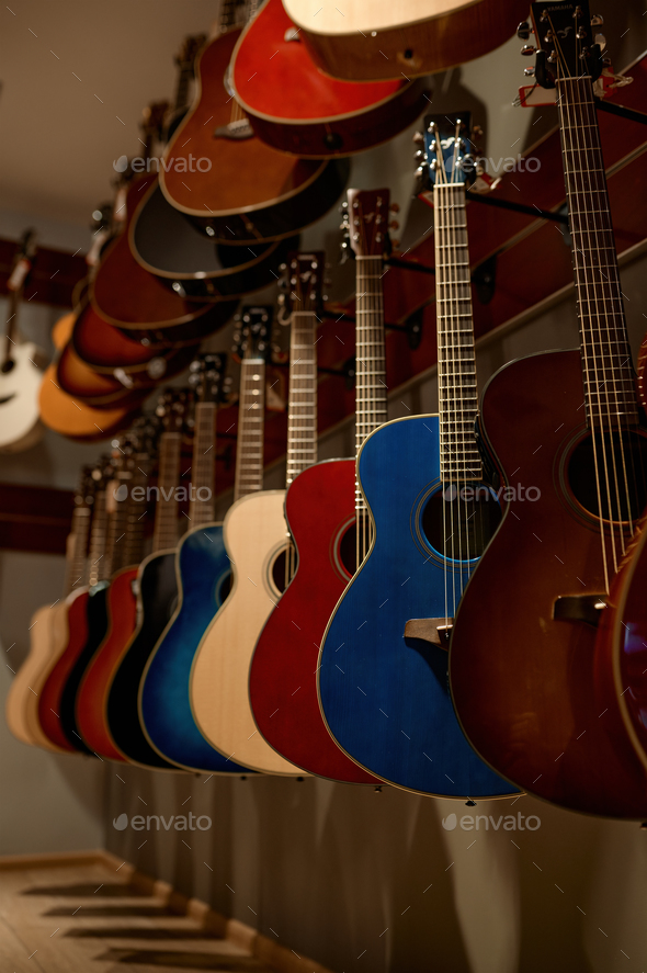Selective focus on rack of guitar string instrument at music shop