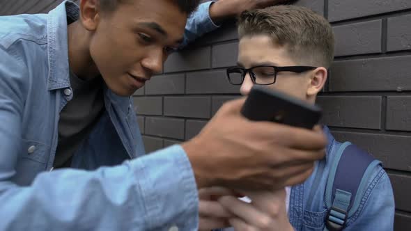 Afro-American Boy Taking Away Phone From Student, Mocking Post in Social Media alt