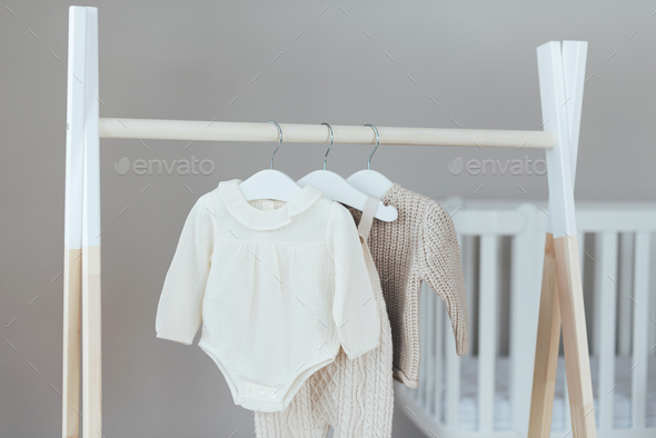 Childs minimal fashion in pastel clothes. Stylish baby or kid blouse, sweater, cardigan, pants
