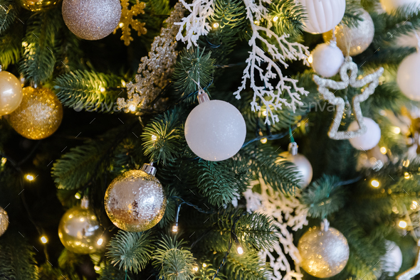 Christmas background from a Christmas tree decorated with golden toys ...