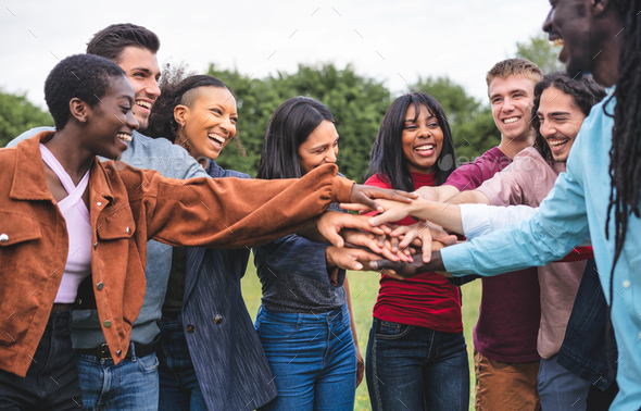 Large group of Multicultural community of friends socializing outdoors ...