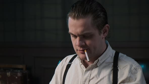 Close Up Look on Face of Real Detective in White Shirt and Suspenders with Cigarette in His Teeth alt