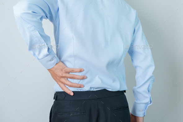 man having back pain. Urinary system and Stones,