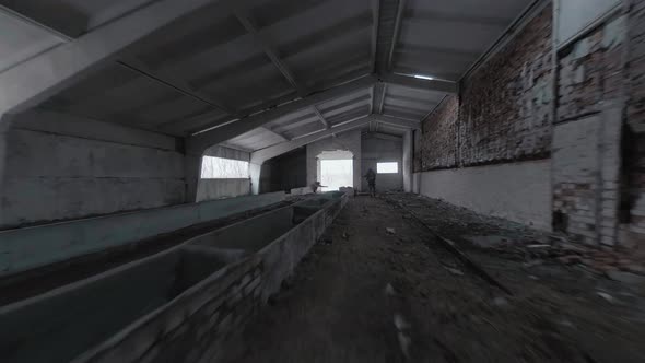 Group of People in Masks and Military Uniforms are Engaged in Airsoft in an Abandoned Building alt