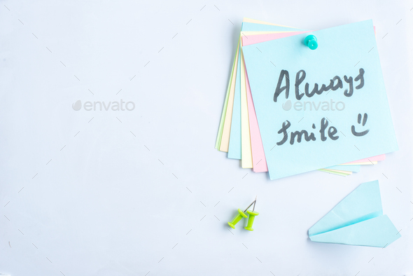 top view always smile note on open copybook on a gray background lesson student note college study