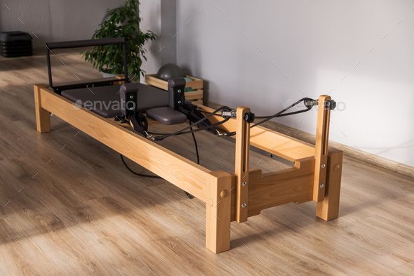 Pilates equipment. Reformer bed. Reformer pilates studio machine for  fitness workouts in gym. Fit Stock Photo by photodiod