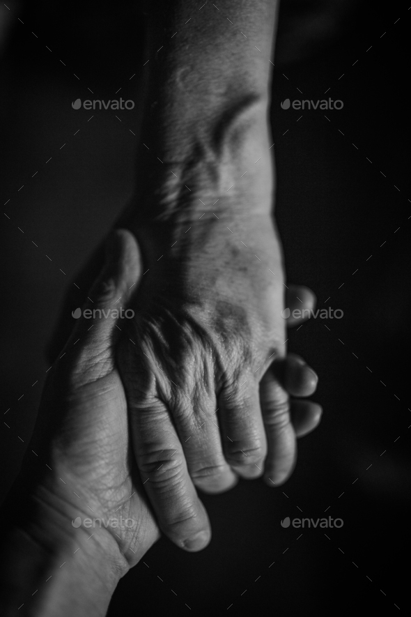 Close up of wrinkled hands, black and white.