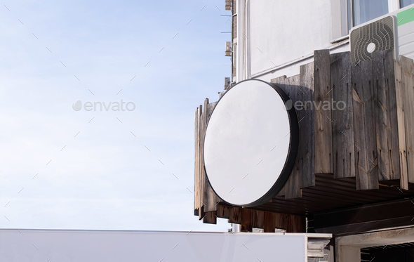 white round logo on building wall , exterior for mockup design