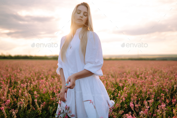 Beauty romantic girl Outdoors at sunset. Young woman in stylish clothes ...