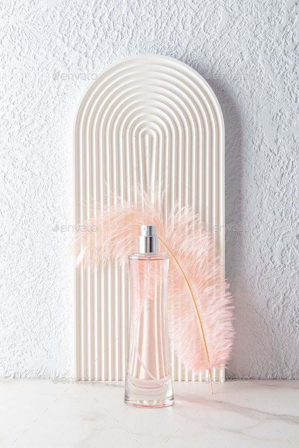 A modern composition of the presentation of the fragrance of women's perfume  in an elegant bottle Stock Photo by mmoskalyuk160462