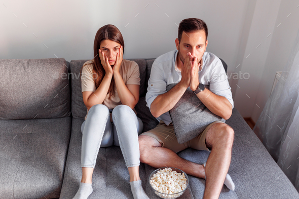 Couple watching horror movie on TV
