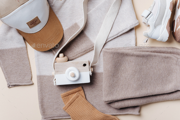 Set of knitted clothes - sweater, pants, shoes, cap, wooden camera toy.