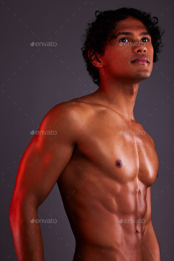 Light, strong and man chest in a studio with art lighting and thinking