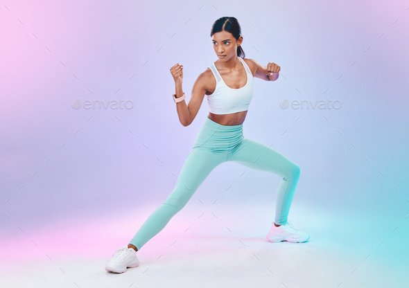 Fitness, woman and fighting pose in studio for karate, martial arts or  defence training on gradient Stock Photo by YuriArcursPeopleimages