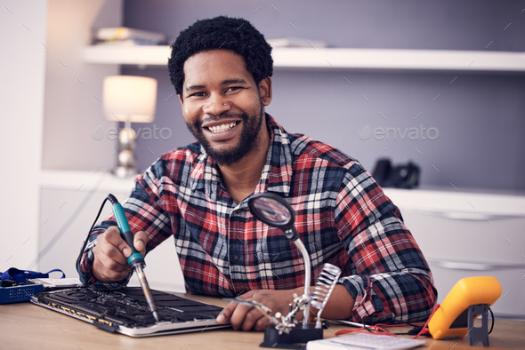 Black man, technician fixing electronics and tablet hardware, soldering iron tools and tech repair.