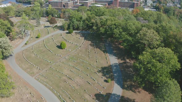 Aerial Drone Shot Flying Over Mt Feake Cemetery Toward Charles River in Waltham