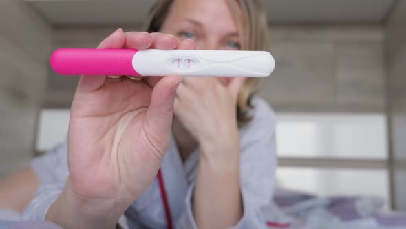 Woman with Pregnancy Test