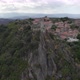 Castle of Sortelha on top of steep cliff; drone arc shot reveals landscape - VideoHive Item for Sale