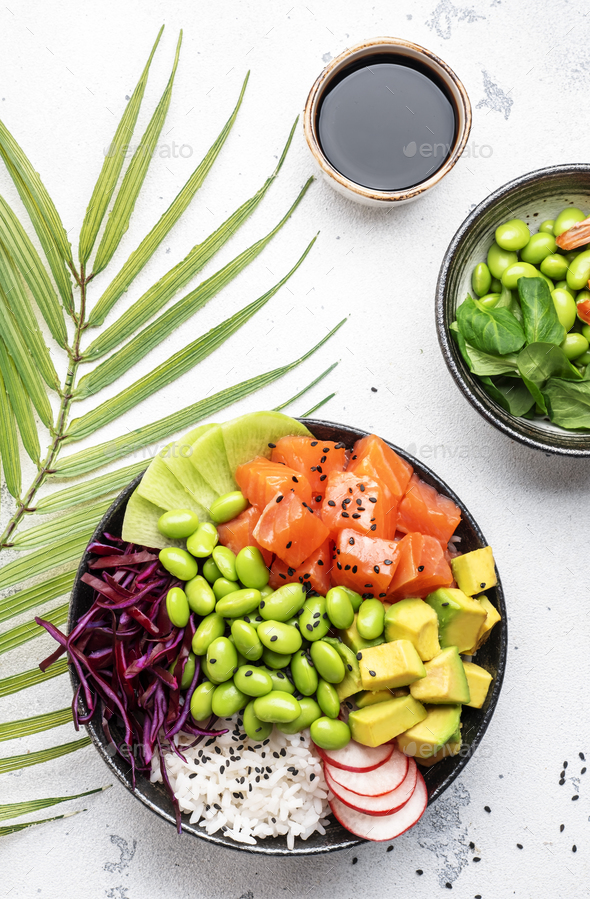 Poke bowl with salted salmon, avocado, radish, edamame beans, cabbage and white rice. Stock