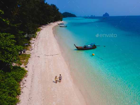 A Couple Walking At The Beach Of Koh Kradan Island In Thailand Stock ...