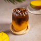 Cold mango and coffee cocktail with ice. Summer party or bar menu concept. - PhotoDune Item for Sale