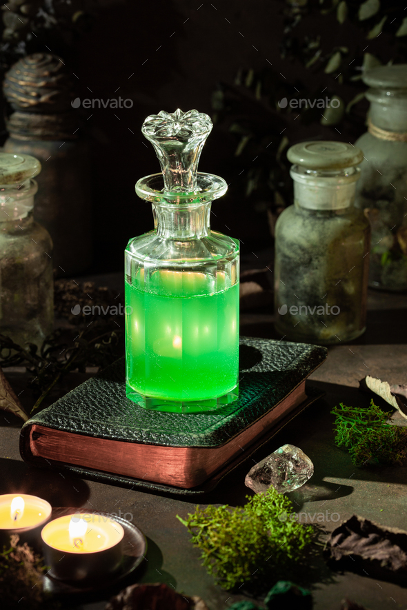 Witchcraft still life concept with potion, herbs ingredients candles and magical equipment