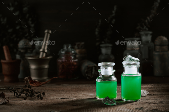 Witchcraft still life concept with potion, herbs ingredients candles and magical equipment