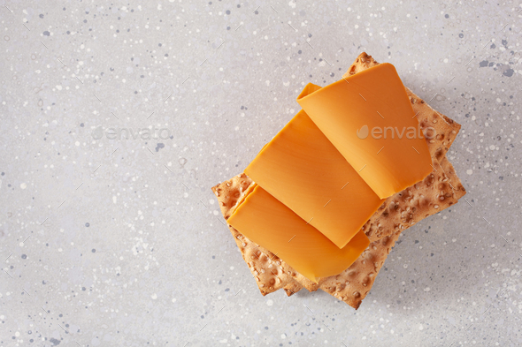 crispbread with Norwegian brunost traditional brown cheese - Stock Photo - Images