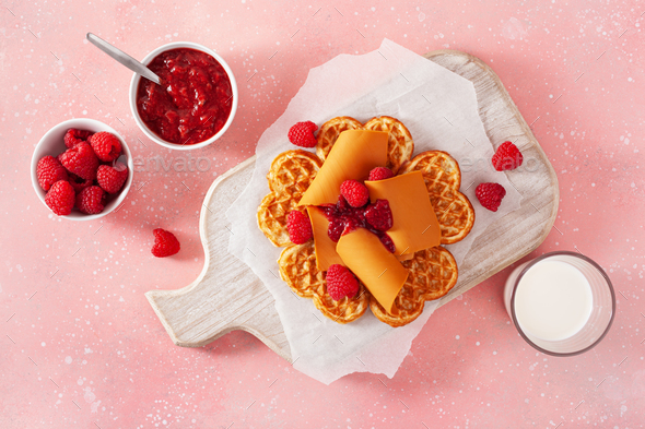 waffles with Norwegian brunost traditional brown cheese and raspberry jam - Stock Photo - Images