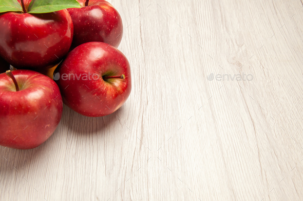 front view fresh red apples mellow and ripe fruits on light white desk fruit color fresh plant red