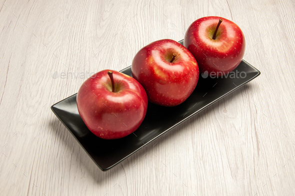 front view mellow red apples fresh fruits inside black pan on white desk fruit mellow ripe fresh red