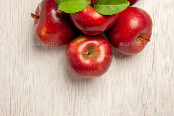 top close view fresh red apples mellow and ripe fruits on white desk fruit color fresh plant red