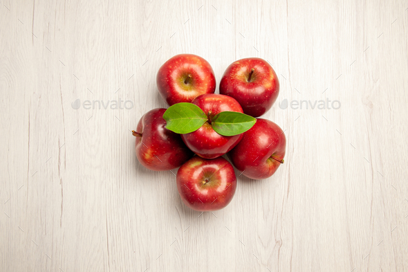 top view fresh red apples mellow and ripe fruits on the white desk fruit color fresh plant red tree