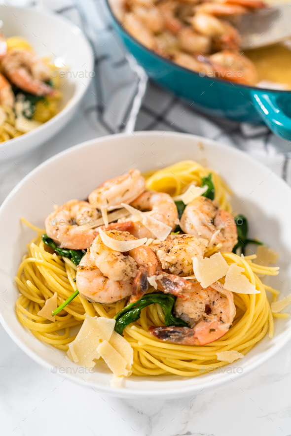 Garlic Shrimp Pasta with Spinach Stock Photo by arinahabich PhotoDune