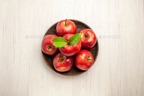 top view fresh red apples ripe and mellow fruits on a white desk fruit red color tree fresh plant