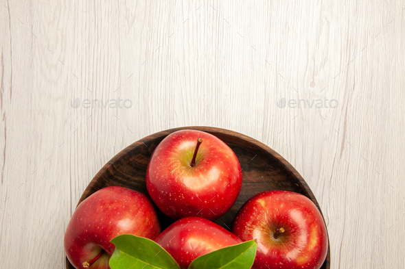 top view fresh red apples ripe and mellow fruits on white desk fruit color tree fresh plant red