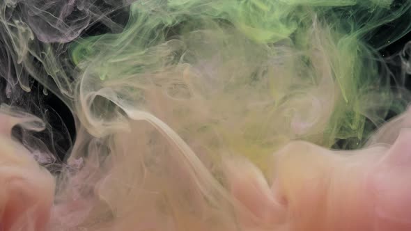 Pink and Yellow Ink Acrylic Paint Mixing in Water Swirling Softly Underwater alt