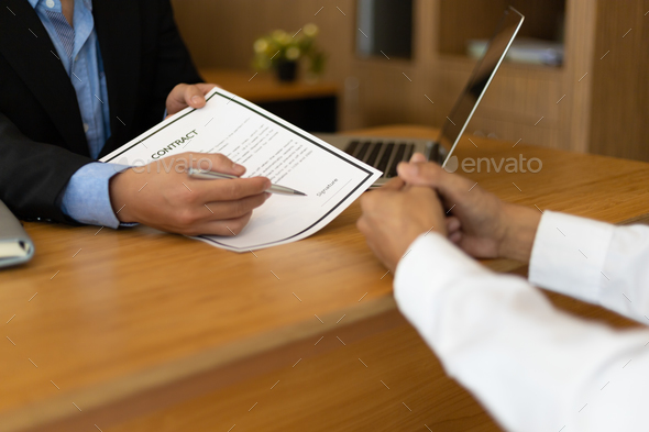 Signing a legal contract agreement. Lawyers are advising clients and discussing contracts.