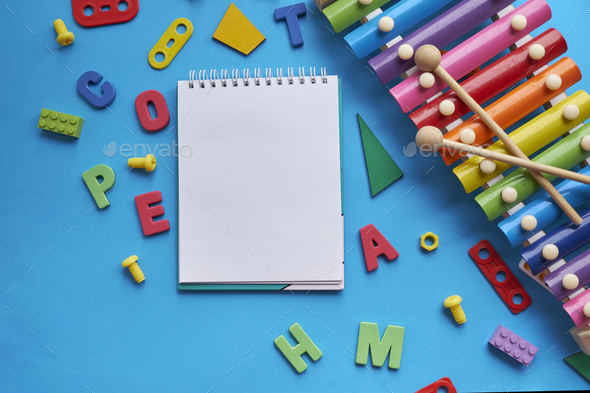 School supplies flat lay, stationery on pink background. Education