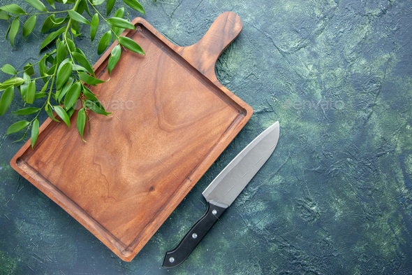 top view brown wooden desk on the dark blue background knife food color meat kitchen ancient butcher